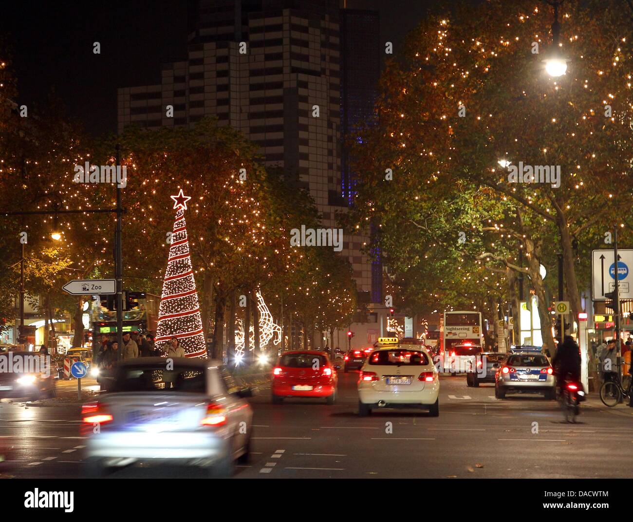 Cars drive along the illuminated Kurfuerstendamm in Berlin, Germany, 22 November 2011. The Christmas lighting was started by the governing mayor before. Photo: Wolfgang Kumm Stock Photo