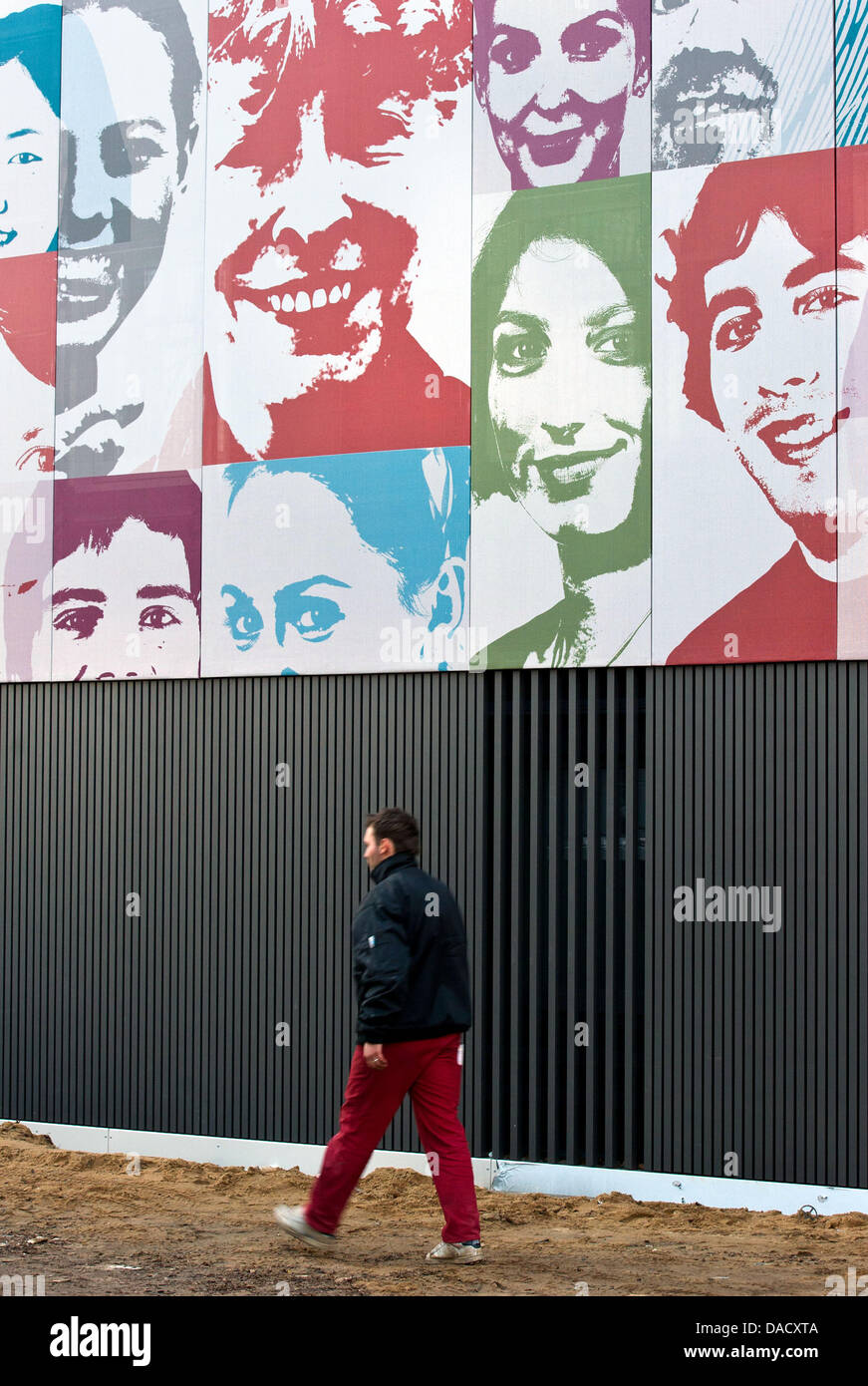 Portraits of students and employees of the Viadrina European University are featured at the fassade of the future datacentre of the university in Frankfurt Oder, Germany, 20 December 2011. About 400 portraits, upon them one of former president Prof.Dr. Gesine Schwan (above-C), decorate the fassade of the building until its completion under the title 'Viadrina-Facewall'. Photo: Patr Stock Photo