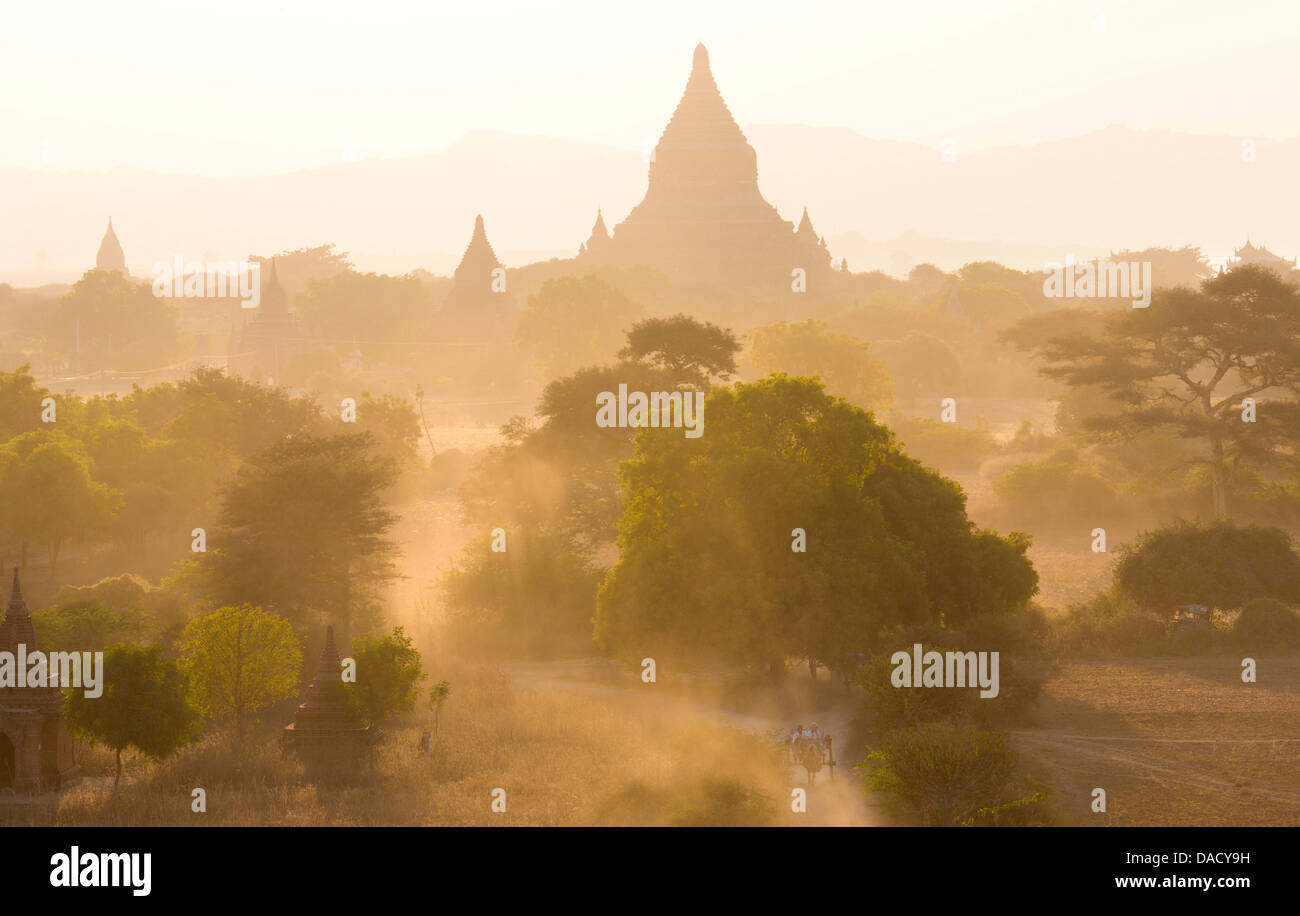 View over the temples of Bagan swathed in dust and evening sunlight, from Shwesandaw Paya, Bagan, Myanmar Stock Photo