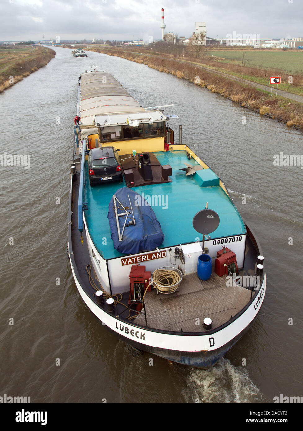Inland navigation vessels transport goods on the Mittelland Canal (also known as Midland Canal) near Haldensleben, Germany, 21 December 2011. At 325 kilometres in length, the Mittelland Canal is the longest artificial waterway in Germany. It forms an important link in the waterway network of that country, providing the principal east-west inland waterway connection. Photo: Jens Wol Stock Photo