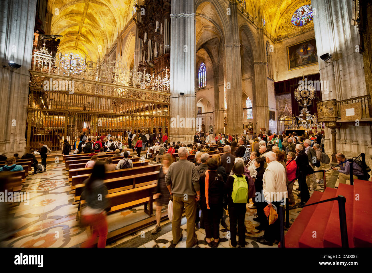 Group of tourists on sightseeing tour in the Seville Cathedral, Andalusia, Spain. Stock Photo