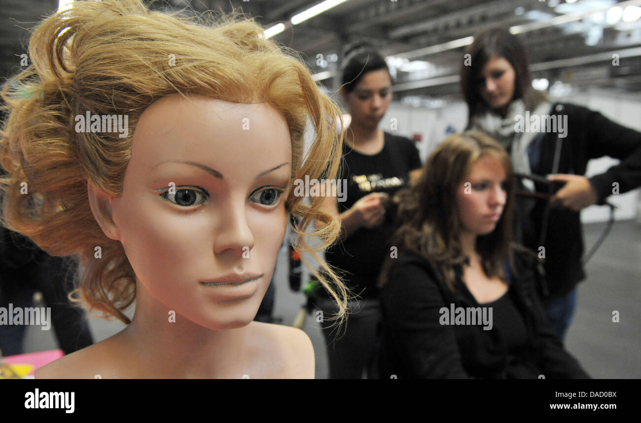 Women demonstrate the occupation of a hairdresser at the fair 'Forum