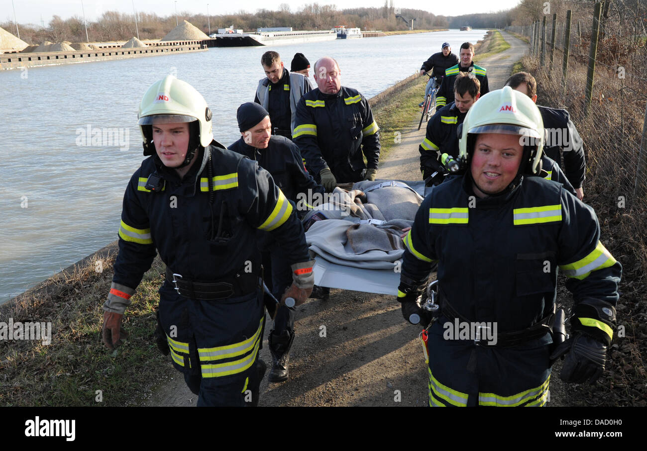 Firefighters carry an exhausted roe buck in Hanover, Germany, 28 ...