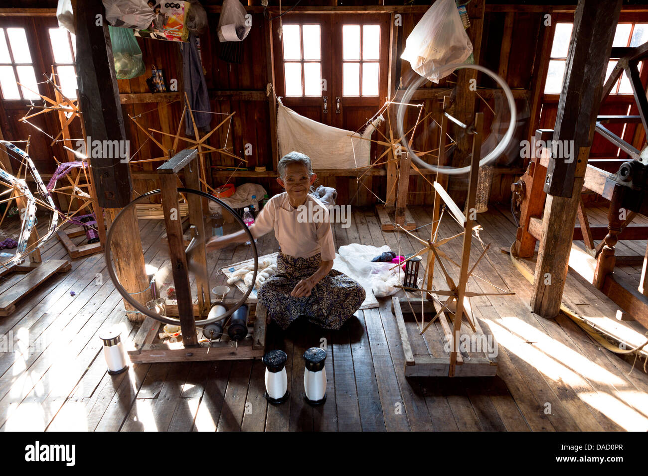 Woman spinning silk in factory in In Phaw Khone village, Inle Lake, Myanmar (Burma), Southeast Asia Stock Photo