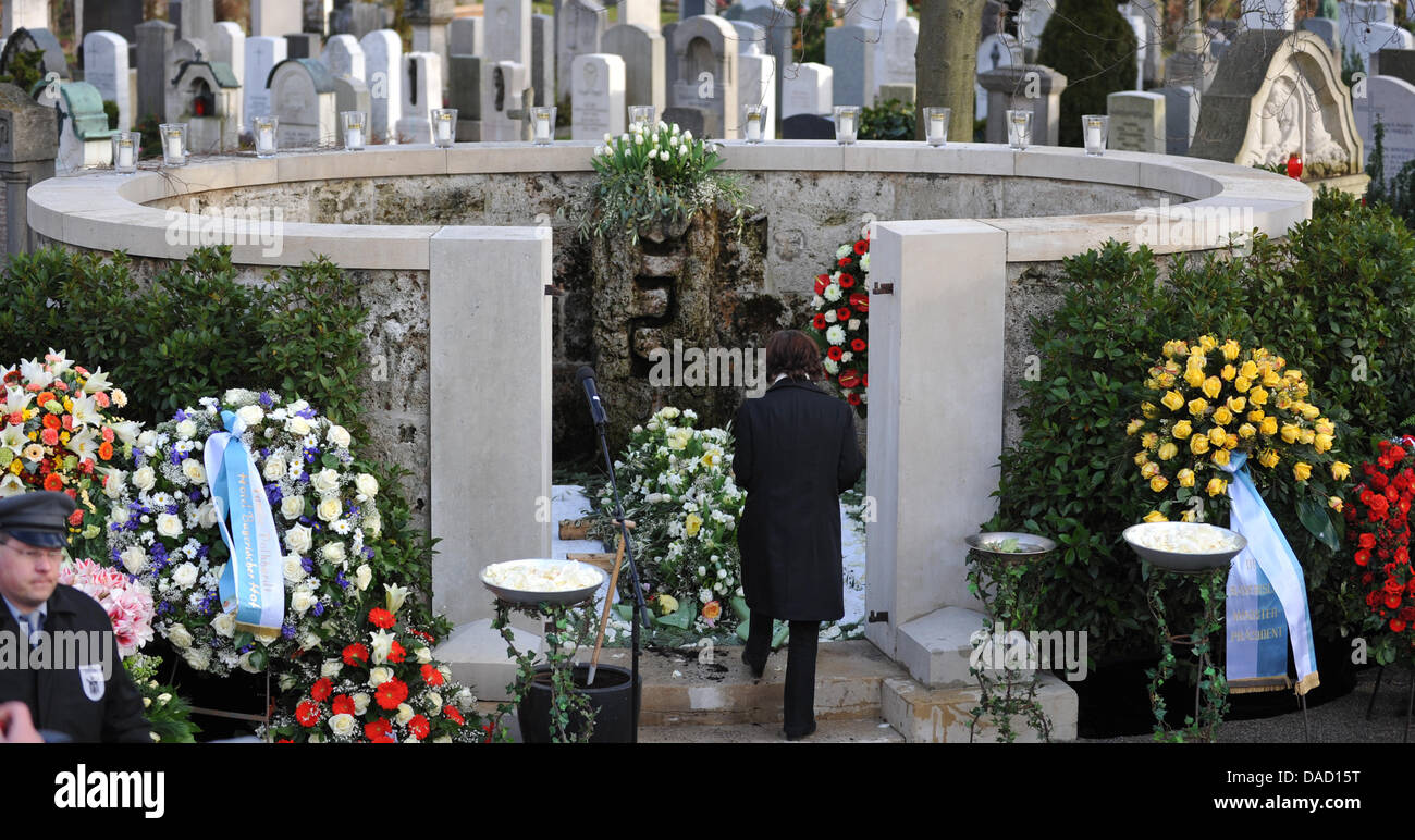 Widow Simone Rethel walks to the grave of Johannes Heesters during the  funeral service for her husband Heesters at the north cemetery in Munich,  Germany, 30 December 2011. Relatives, colleagues and friends