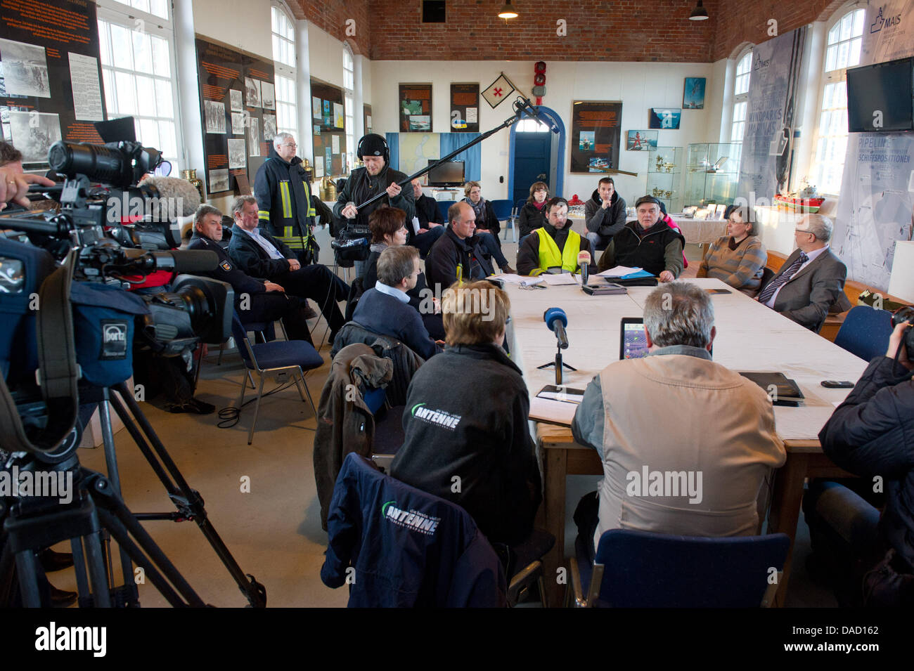 Chief of operations Daniel Hartlieb (back row-yellow vest) and mayor of Putgarten, Ernst Heinemann (3-R), give a press conference after the search for a girl lost in an accident at the steep coast Kap Arkona at the Baltic Sea was stopped in Putgarten on the island Ruegen, Germany, 29 December 2011. Rescue forces had to stop their search for a ten-year-old girl, who was buried under Stock Photo