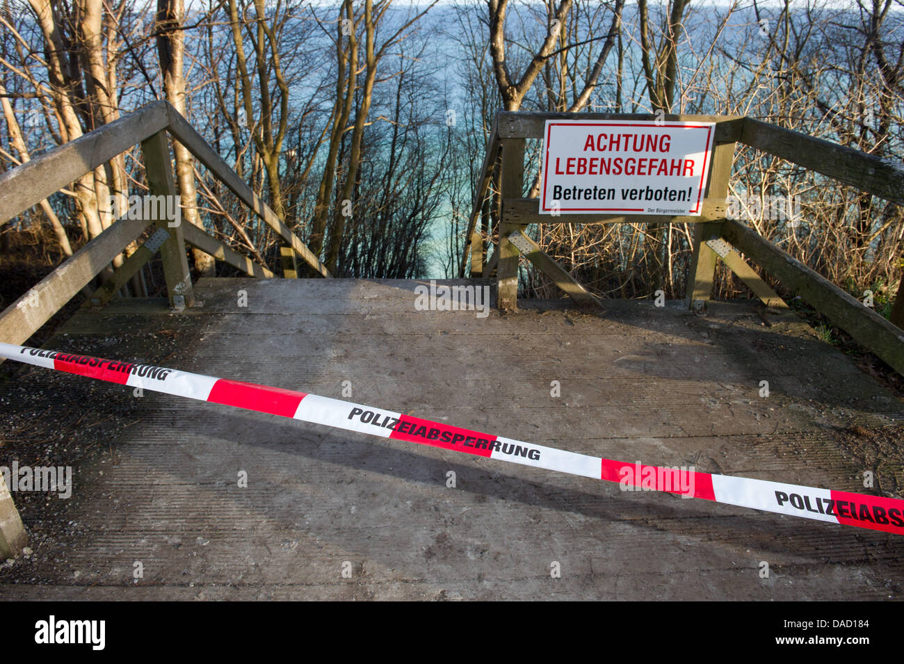 (NEW! - CORRECTED VERSION)  A pathway leading towards a scene of an accident at the steep coast Kap Arkona at the Baltic Sea in Putgarten on the island Ruegen as been closed off, Germany, 30 December 2011. Rescue forces had to stop their search for a ten-year-old girl, who was buried underneath several thousand cubic metres of chalk and marl, together with her 14-year-old sister an Stock Photo