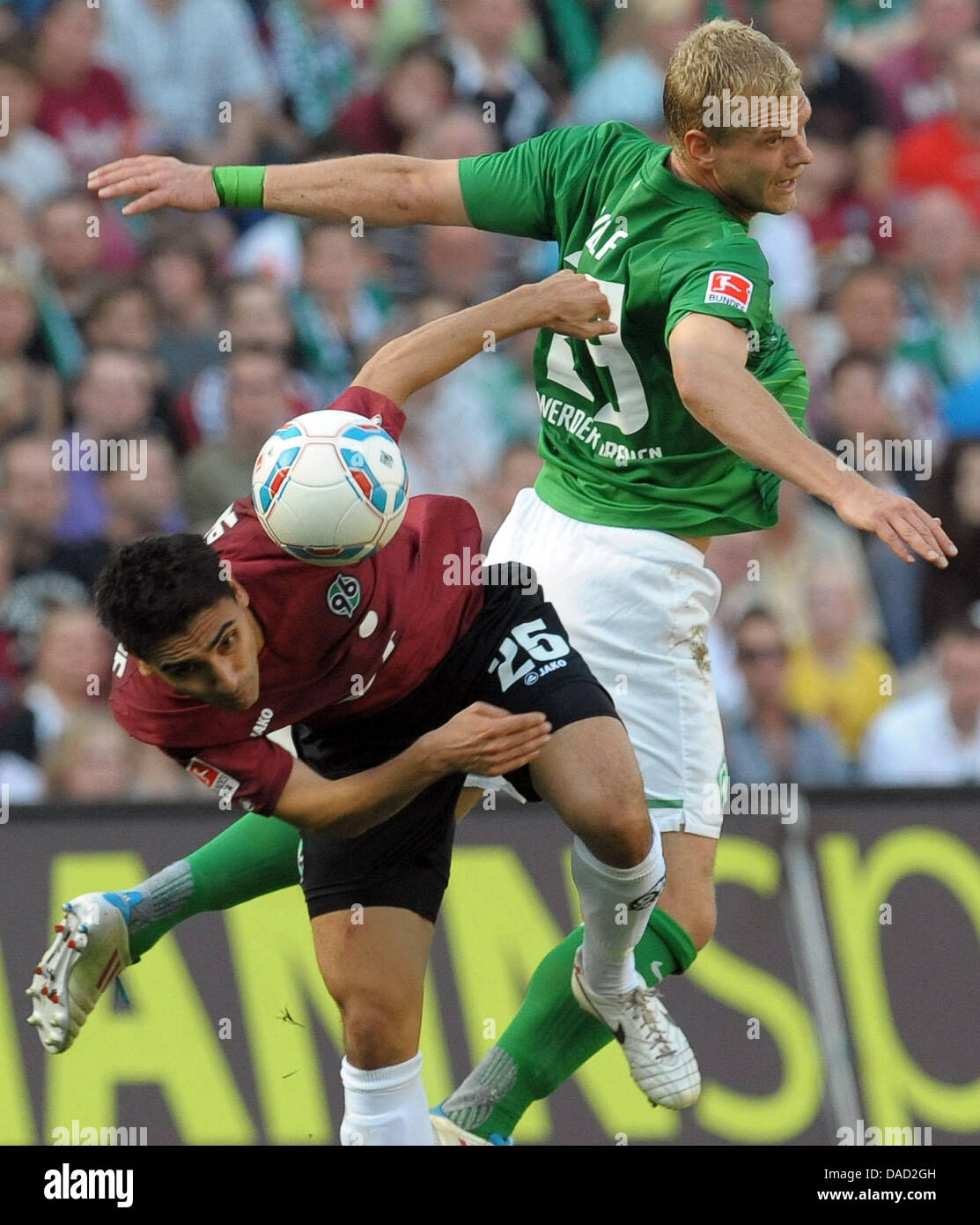 Hanover's Mohammed Abdellaoue (L) vies for the ball with Bremen's Andreas Wolf during the Bundesliga soccer match between Hannover 96 and SV Werder Bremen at the AWD-Arena in Hanover, Germany, 02 October 2011. Bremen won the match 2-3. Photo: PETER STEFFEN (ATTENTION: EMBARGO CONDITIONS! The DFL permits the further utilisation of the pictures in IPTV, mobile services and other new  Stock Photo