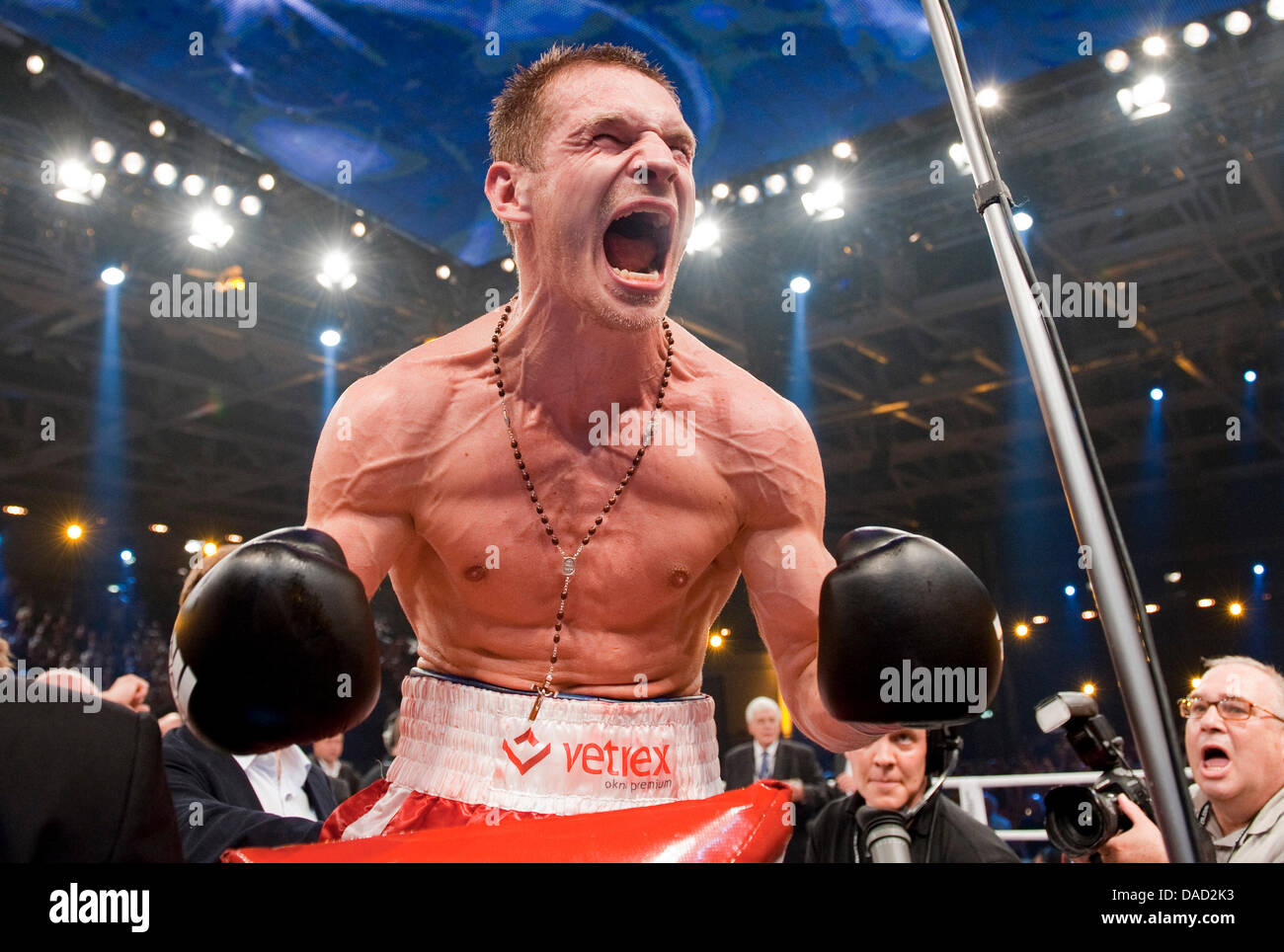 Polish boxer Grzegorz Proksa cheers after his victory against Sylvester at  the European middlweight championship-fight in Neubrandenburg, Germany, 01  October 2011. Proska won in the 4th round and is therewith the new