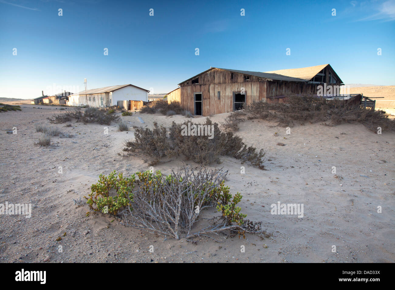 Buildings in the abandoned diamond mining town of Kolmanskop, Namib Desert, Forbidden Diamond Area near Luderitz, Namibia Stock Photo