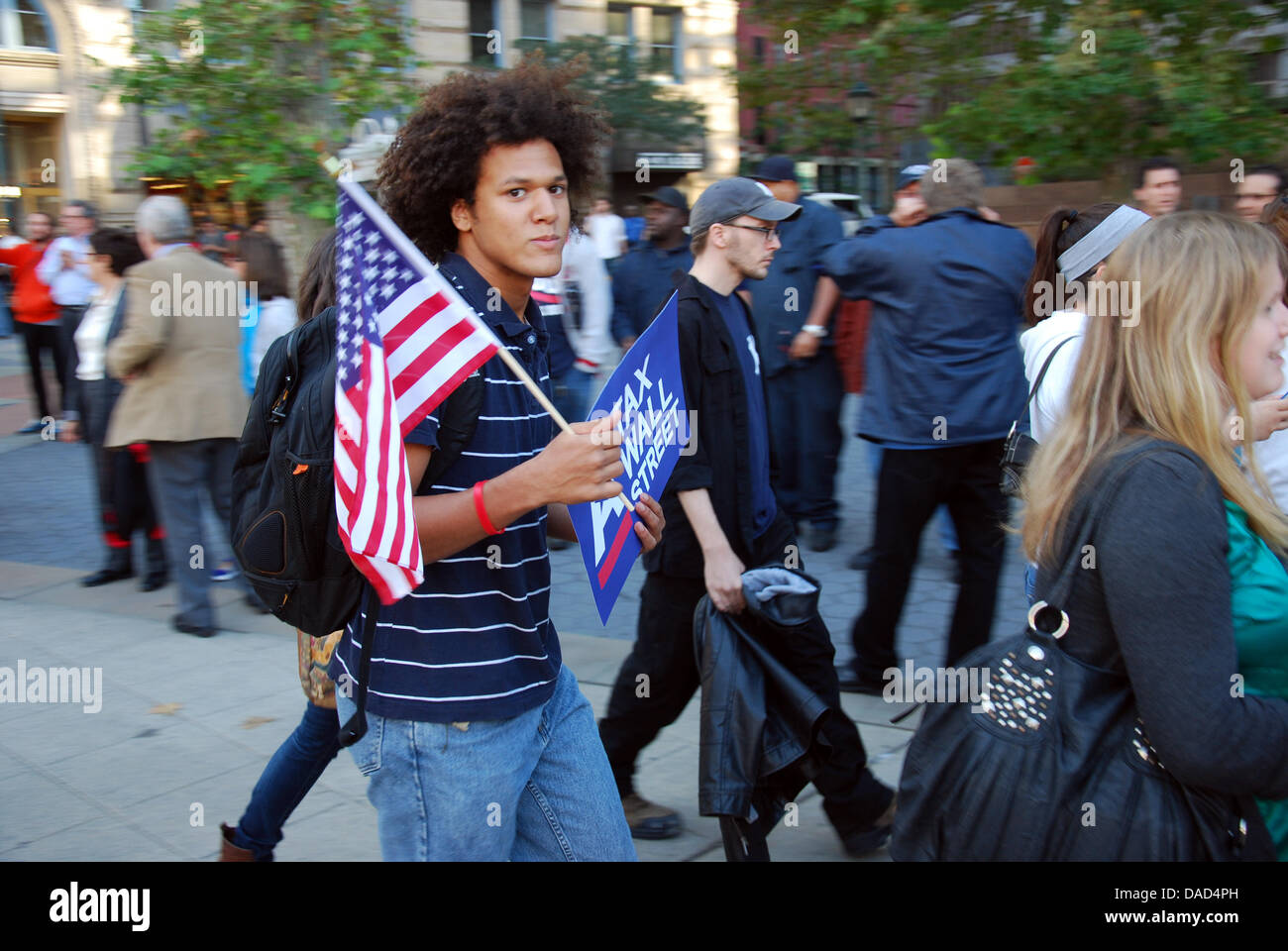 A man demonstrates with a US flag near the town hall in New York