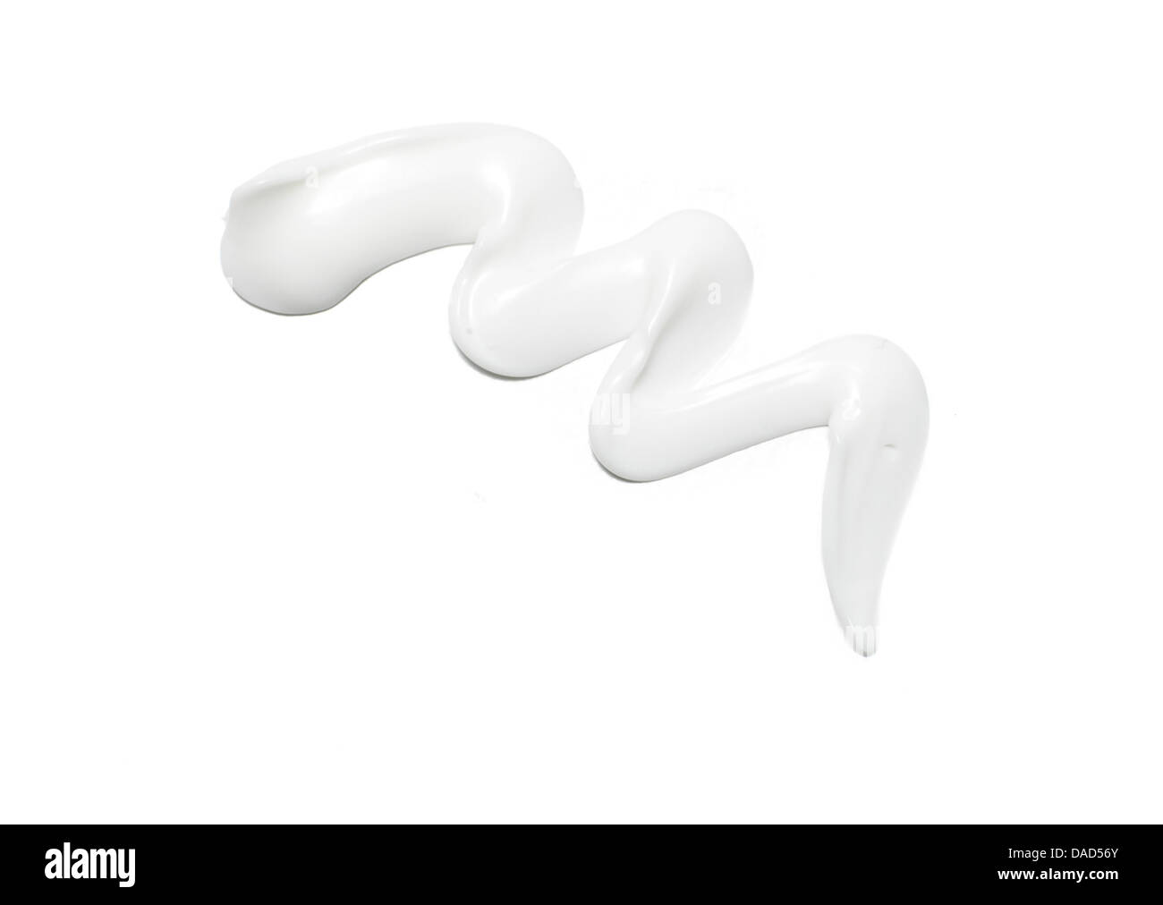 sweep of white beauty cream oil gel product cut out onto a white