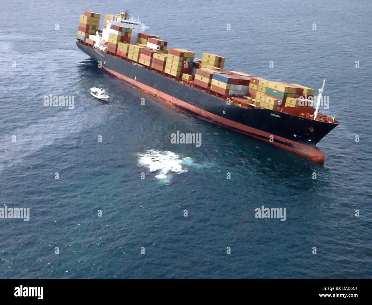 A fly-over shot of stranded cargo vessel «Rena» grounded on the ...