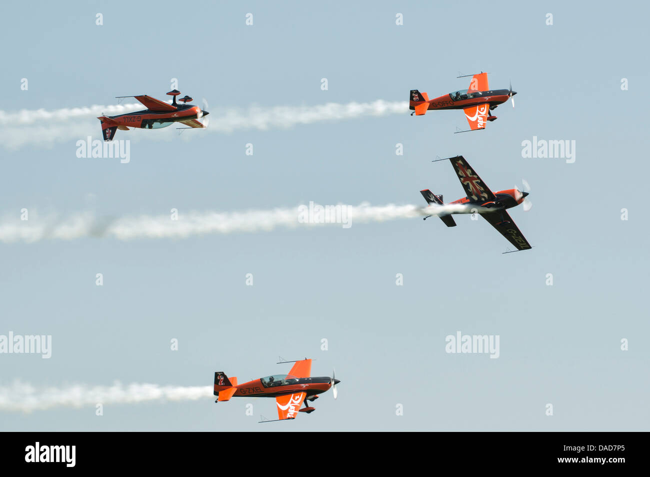 The Blades aerobatic display team execute some precision flying in their Extra 300 performance aircraft at Waddington Stock Photo