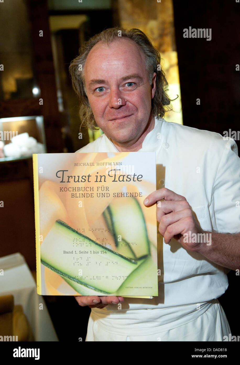 The Michelin-starred chef Michael Hoffmann poses during the presentation of the cookbook  'Trust in Taste - Kochbuch fuer Blinde und Sehende' ('Cookbook for blind and sighted persons') inside the kitchen of the restaurant Margaux in Berlin, Germany, 11 October 2011. The recipes are printed in black letters for sighted readers as well as in contracted Braille printed onto the food p Stock Photo