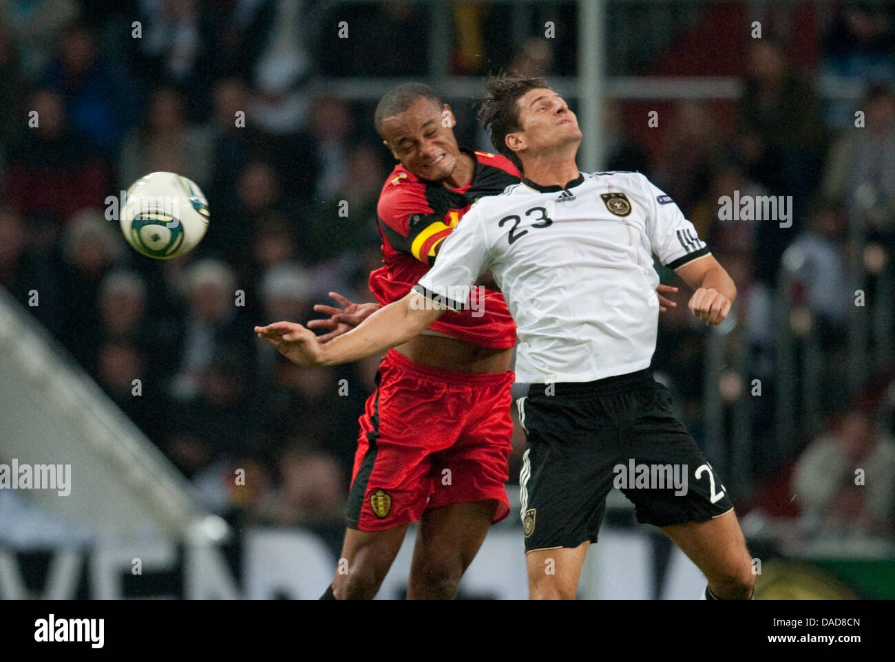 Germany's Mario Gomez (R) and Belgiums Vincent Kompany fight for the ball during the Group A EURO 2012 qualifying match between Germany and Belgium at the Esprit Arena in Duesseldorf, Germany, 11 October 2011. Photo: Bernd Thissen dpa/lnw  +++(c) dpa - Bildfunk+++ Stock Photo