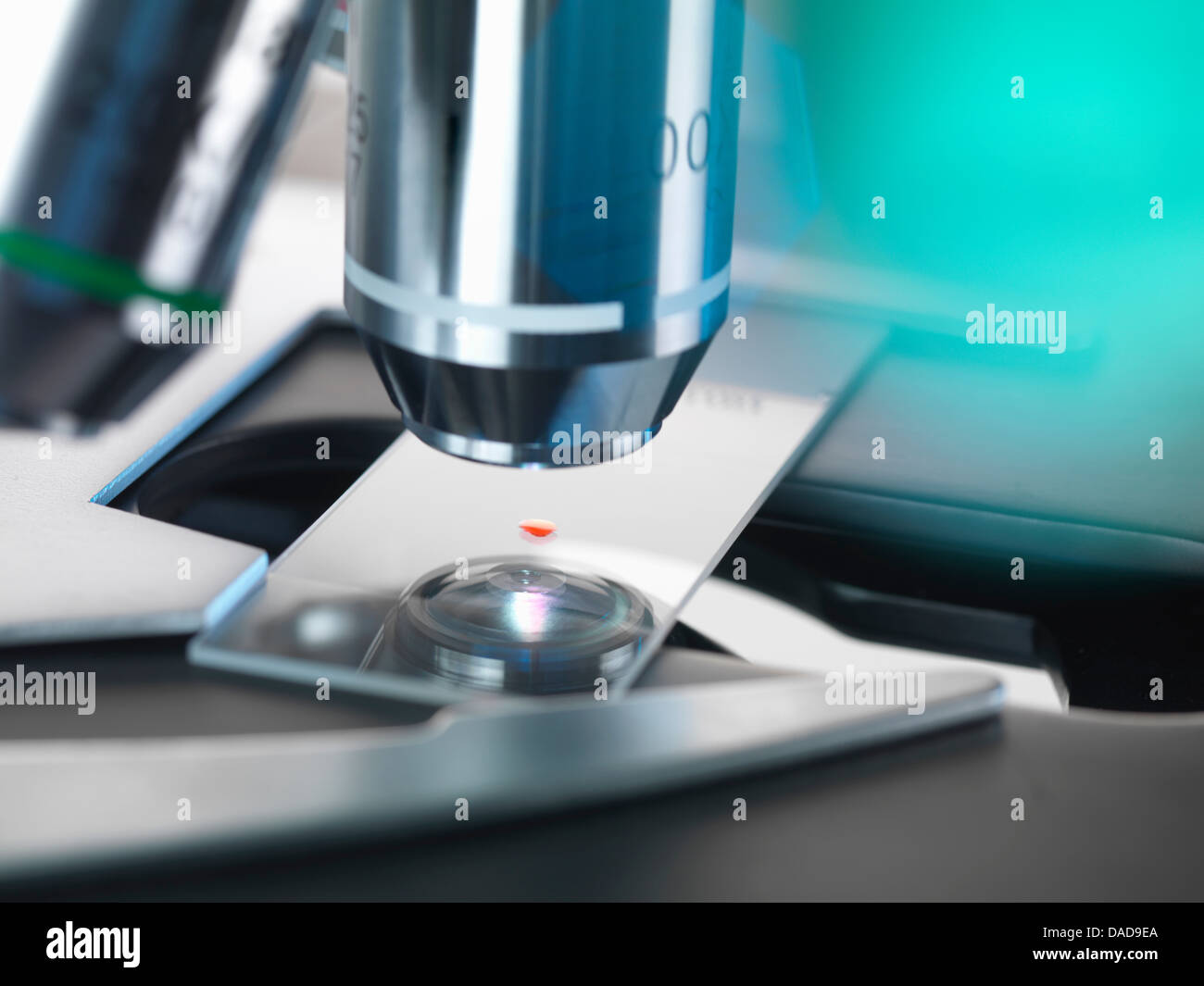 Blood testing, A light microscope examining a sample of blood in a lab Stock Photo