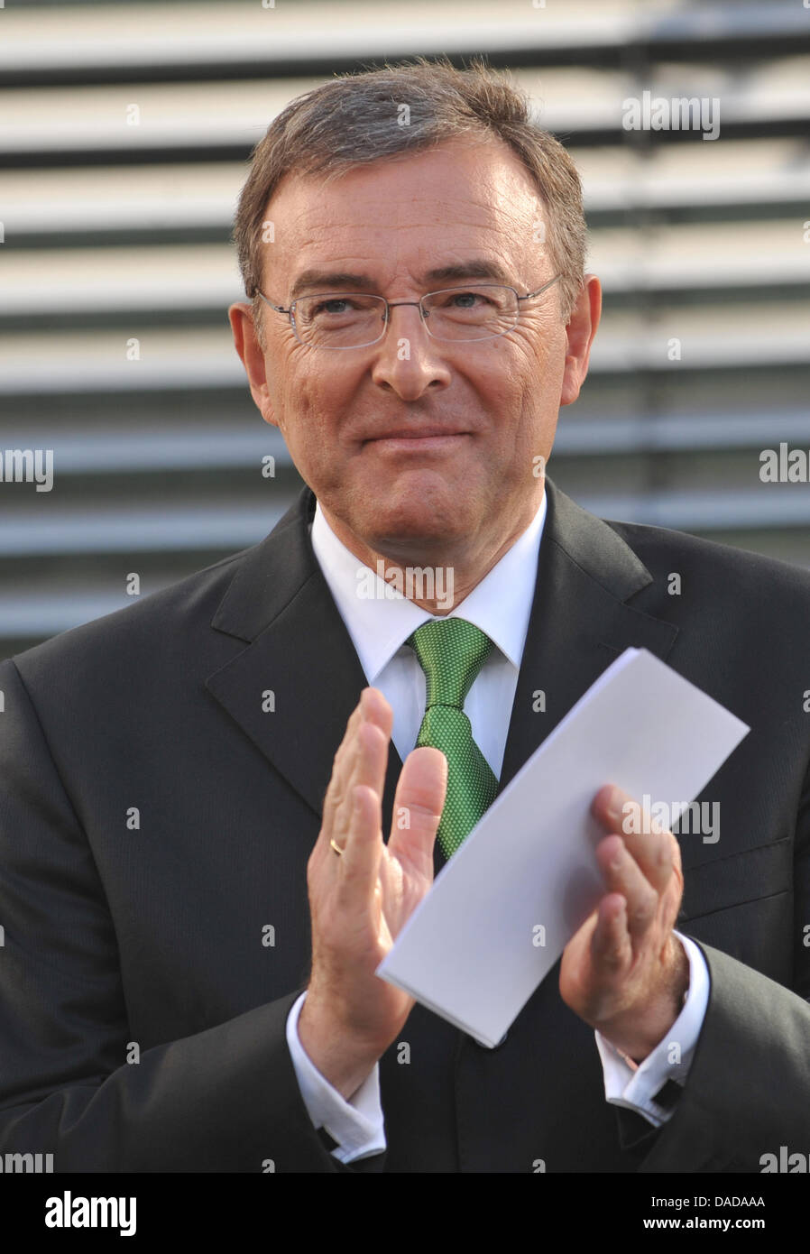 CEO of BMW Norbert Reithofer claps during the presentation of the new BMW 3 Series in Munich, Germany, 14 October 2011. BMW is ceremonially presenting the sixth generation of the BMW 3 Series. Photo: ANDREAS GEBERT Stock Photo