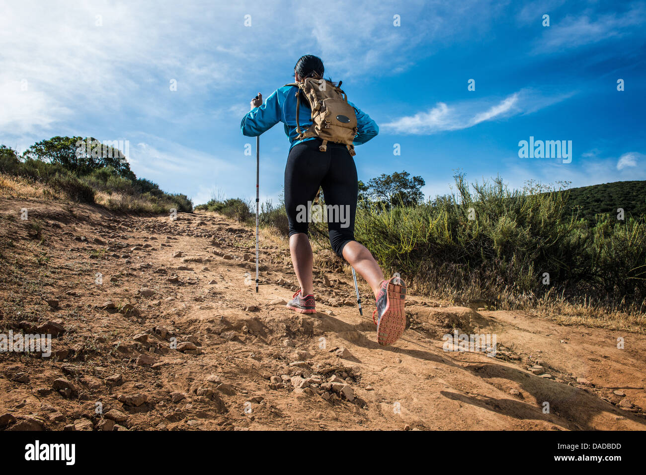 Young woman hiking, rear view Stock Photo - Alamy