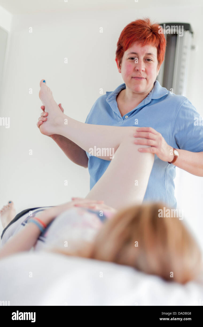 Woman giving physio treatment Stock Photo