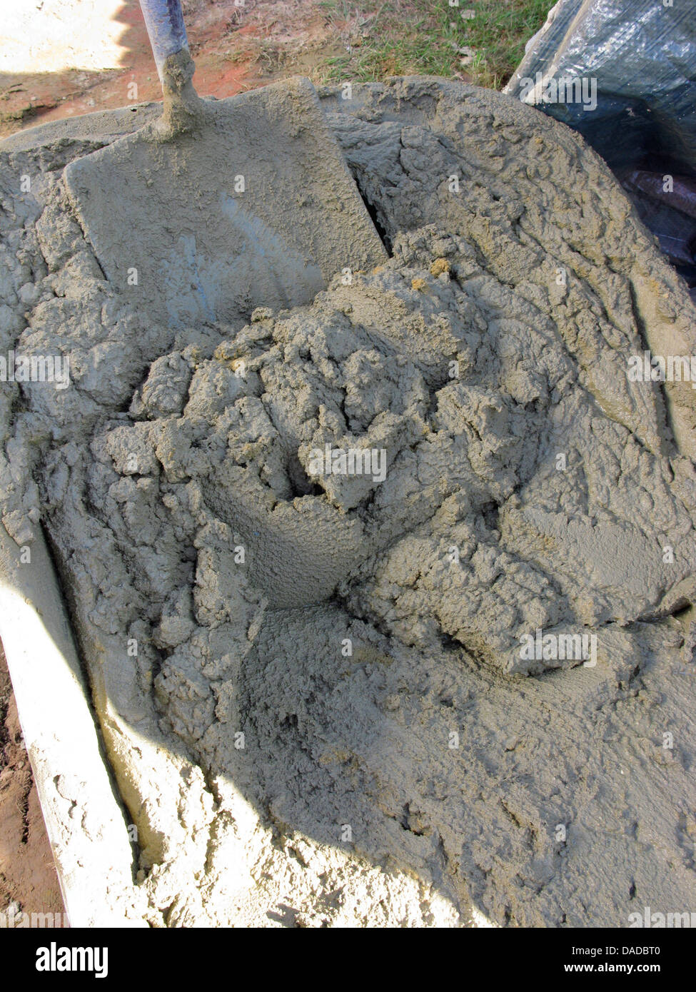 Cement in a wheelbarrow ready for use Stock Photo Alamy