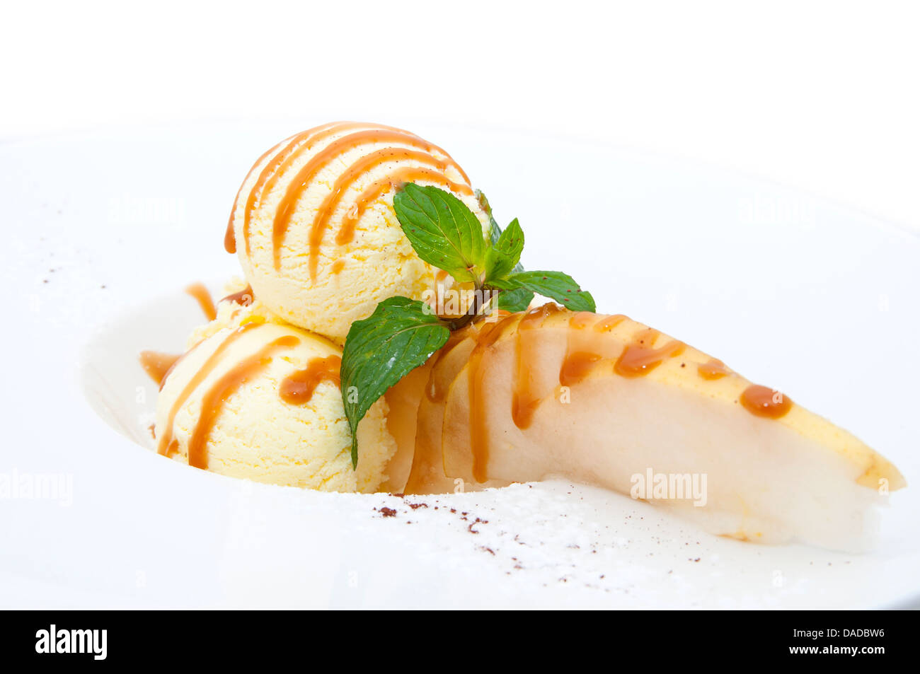 ice cream with caramel sauce and mint on a white background Stock Photo ...