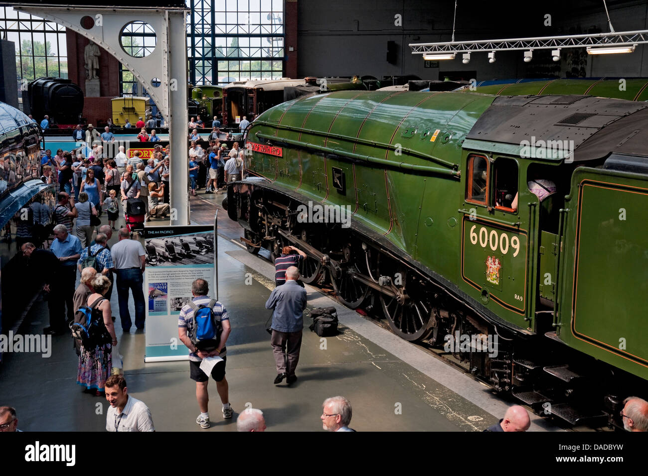 People tourists visitors looking at A4 Pacific Steam Train locomotive at the National Railway Museum York North Yorkshire England UK United Kingdom Stock Photo