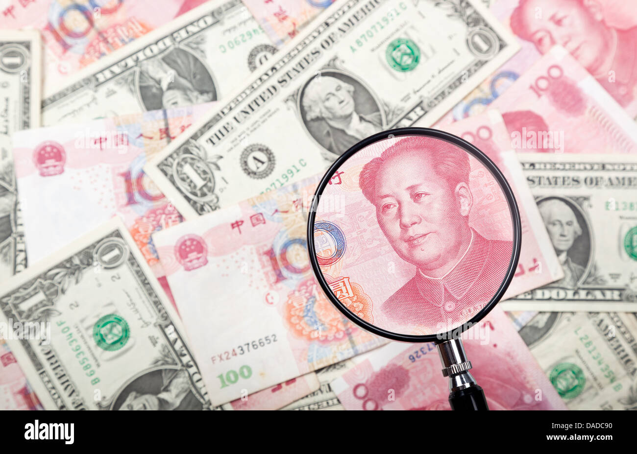 Focusing on Chinese yuan against US and Chinese currencies background Stock Photo