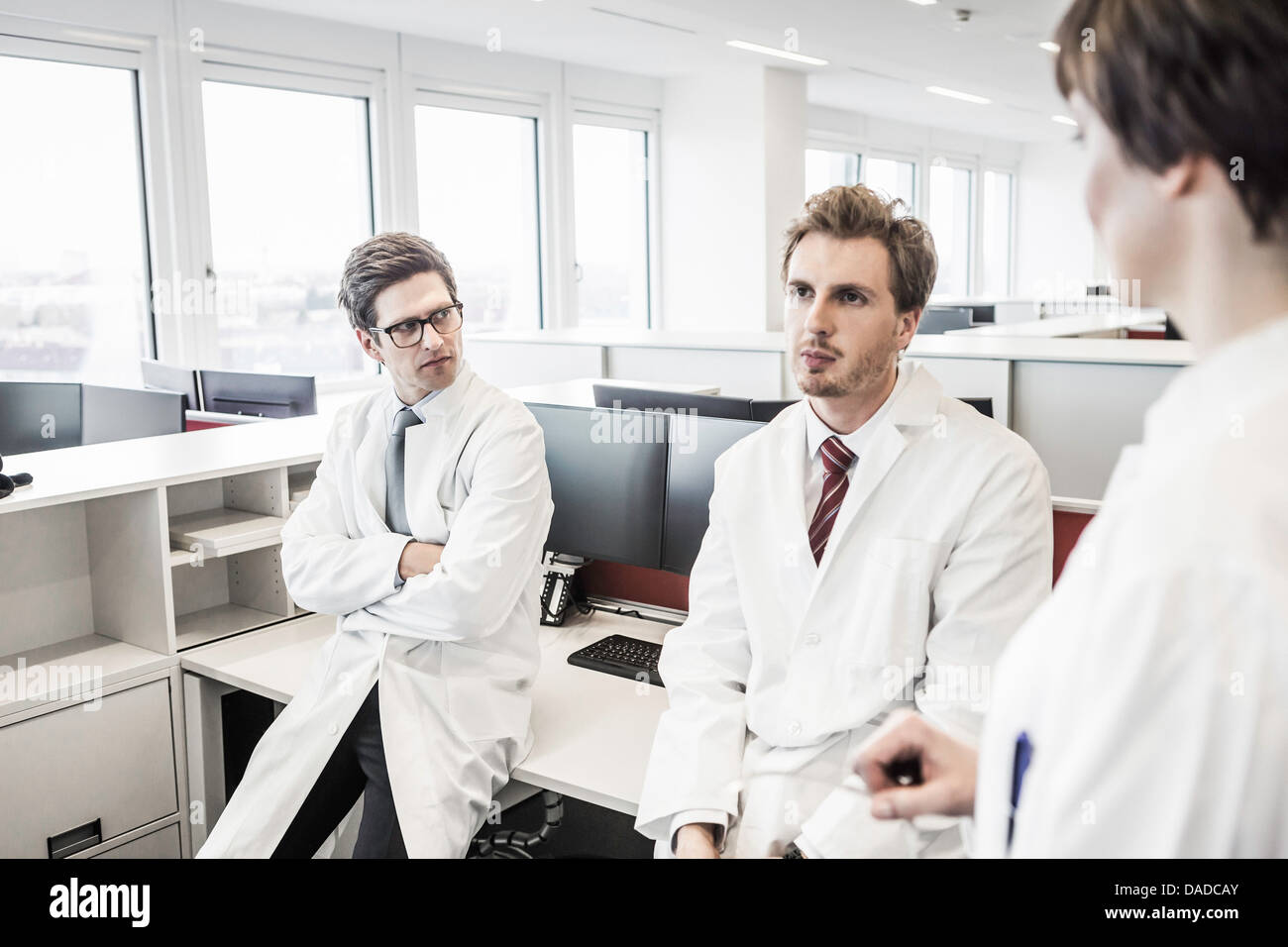 Two men standing with arms crossed hi-res stock photography and images ...