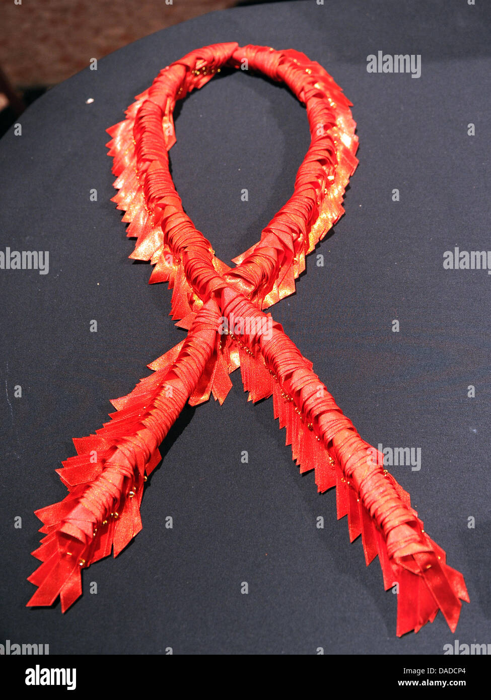 An AIDS-ribbon made of many small AIDS-ribbon-buttoms is seen during ...