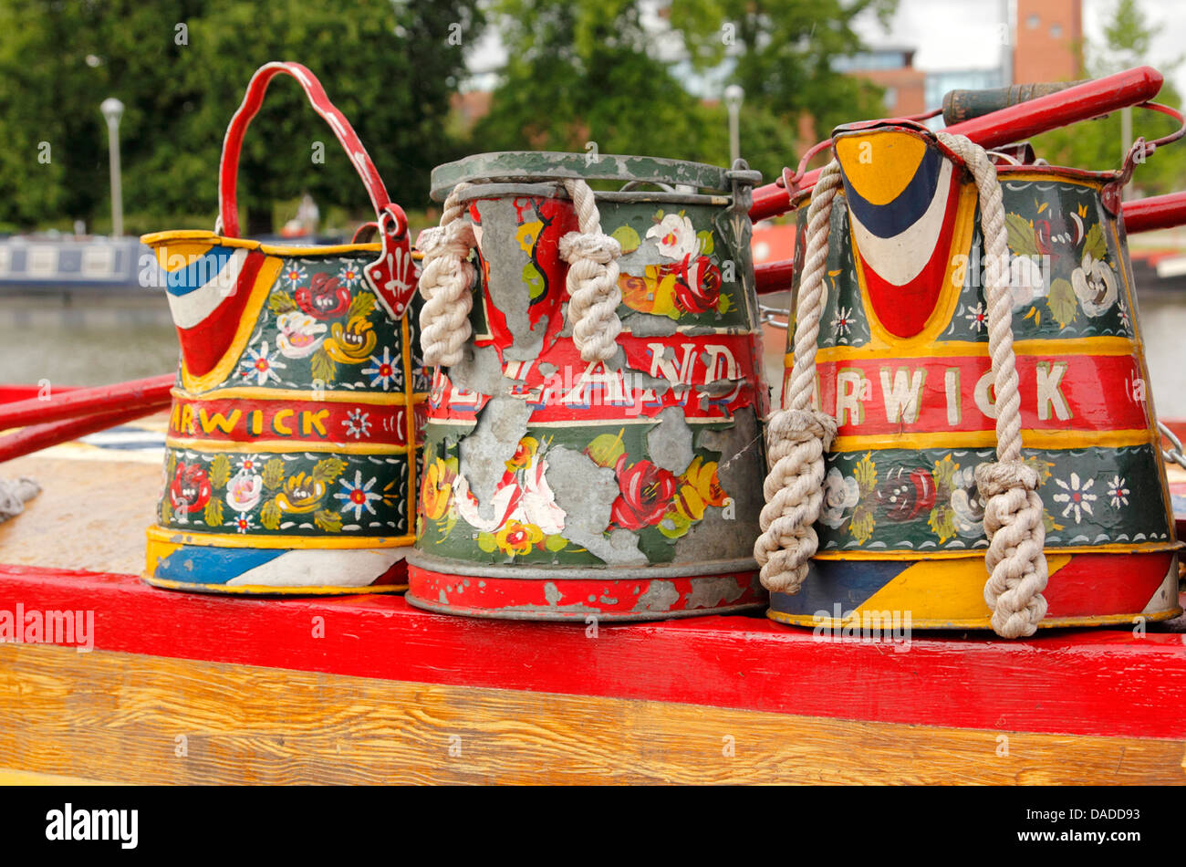 Traditional canal boat hand painted pots on roof of canal boat Stock Photo