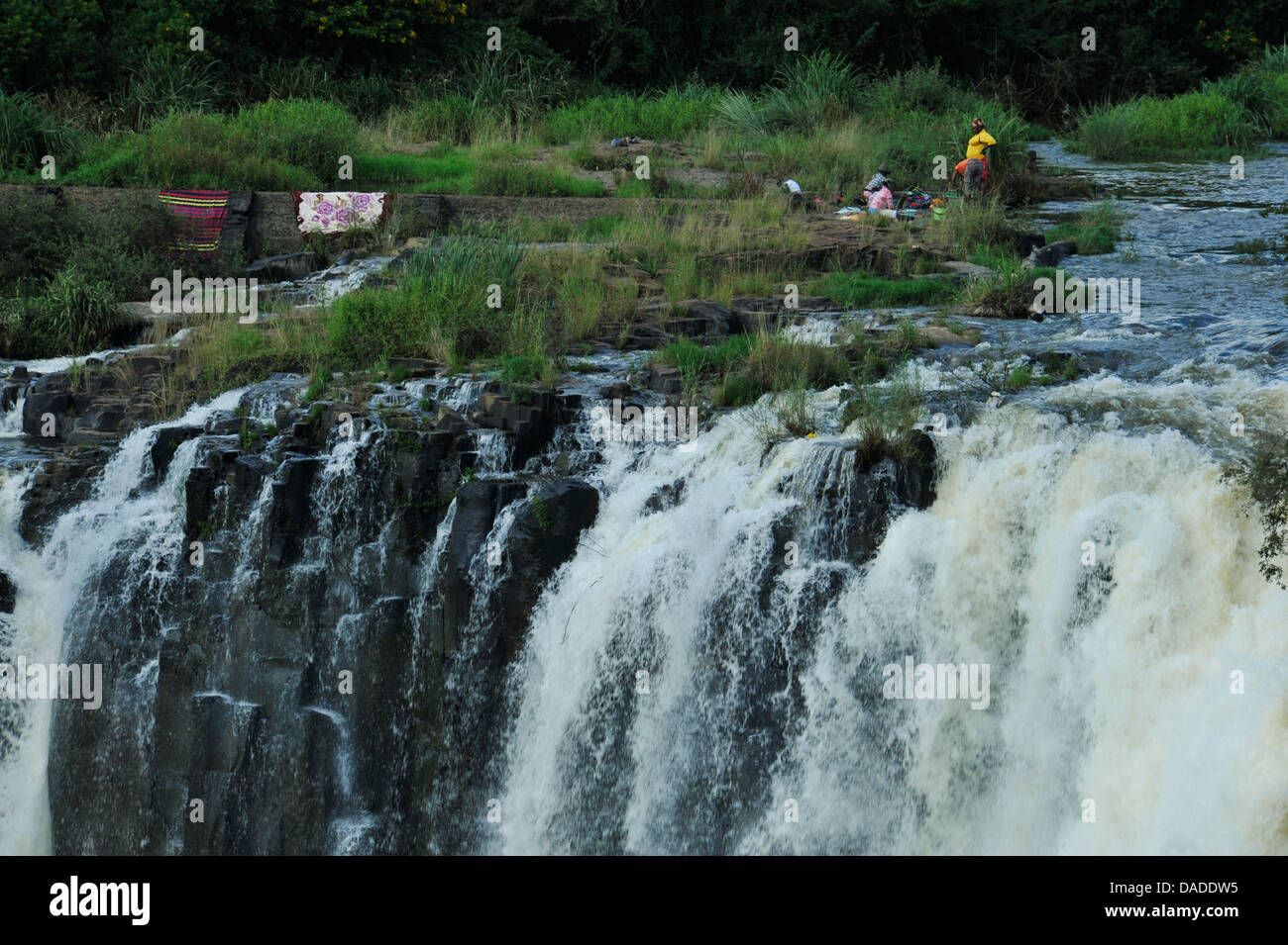 Howick, KwaZulu-Natal, South Africa, people washing laundry in Umgeni river, close to waterfall, landscape Stock Photo