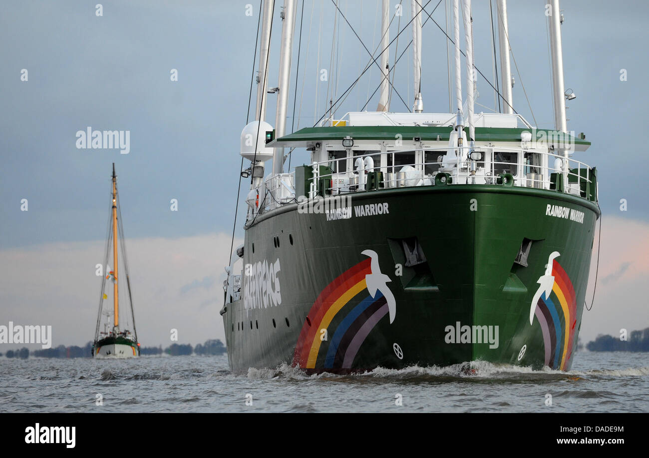 New Greenpeace flagship 'Rainbow Warrior III' is accompanied on the start of its maiden voyage by older Greenpeace vessel 'Beluga II' (L) on the Elbe at Stade near Hamburg, Germany,  20 October 2011. Photo: CHRISTIAN CHARISIUS Stock Photo