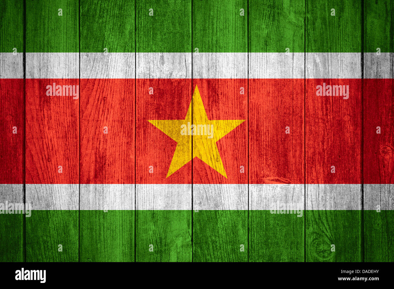 flag of Suriname or Surinamese banner on wooden background Stock Photo