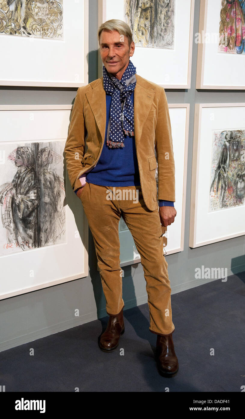 German fashion designer Wolfgang Joop stands next to a selection of his own  illustrations in Passau, Germany, 21 October 2011. 