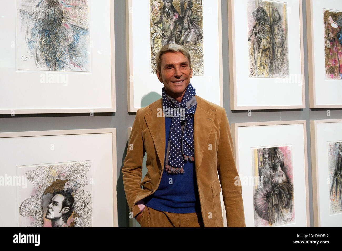 German fashion designer Wolfgang Joop stands next to a selection of his own  illustrations in Passau, Germany, 21 October 2011. "Stillstand des  Fluechtigen", a large retrospective devoted to the graphic work of