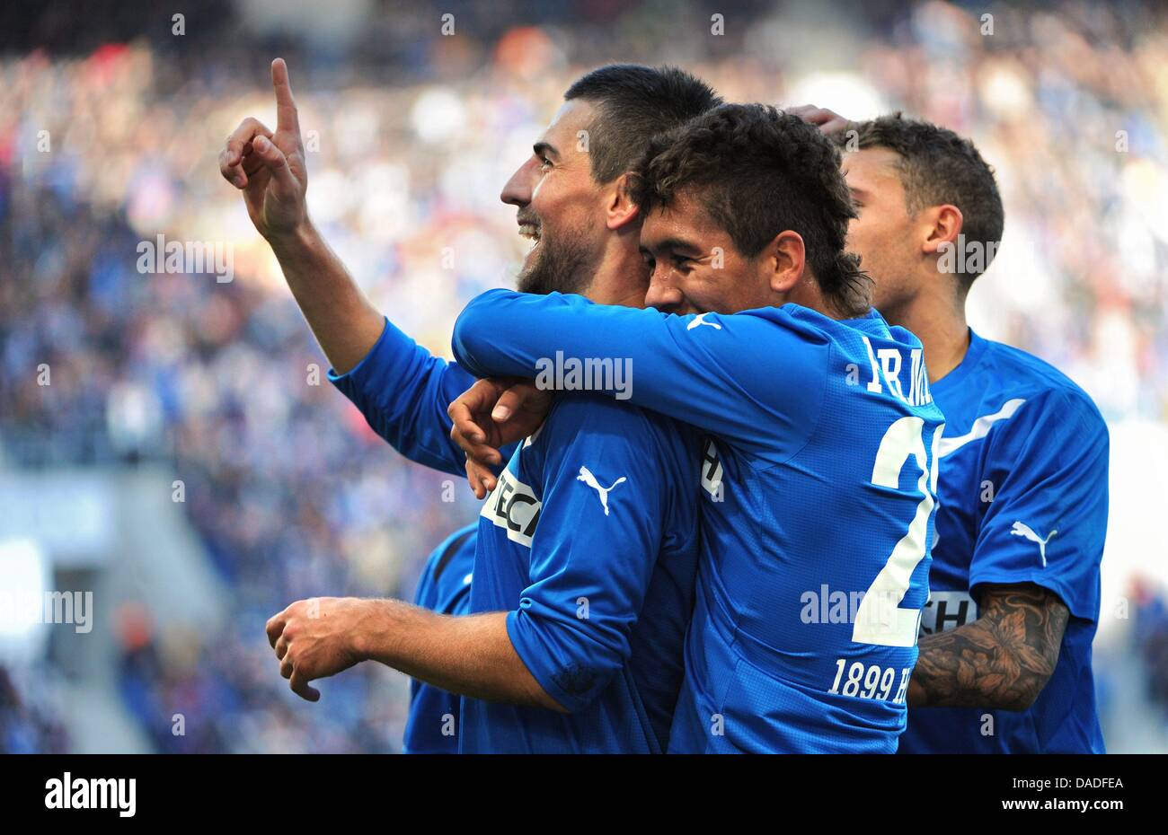 Hoffenheim's Vedad Ibisevic celebrates his 1-0 goal with teammates Fabian Johnson (R) and Roberto Firmino during the German Bundesliga soccer match between TSG 1899 Hoffenheim and Borussia Moenchengladbach at the Rhein-Neckar-Arena in Sinsheim, Germany, 22 October 2011. Photo: MARIJAN MURAT  (ATTENTION: EMBARGO CONDITIONS! The DFL permits the further  utilisation of the pictures in Stock Photo