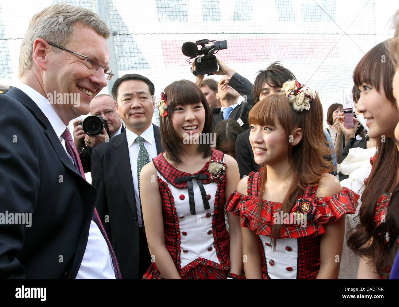 German President Christian Wulff Metts The Japanese Girl Band Akb