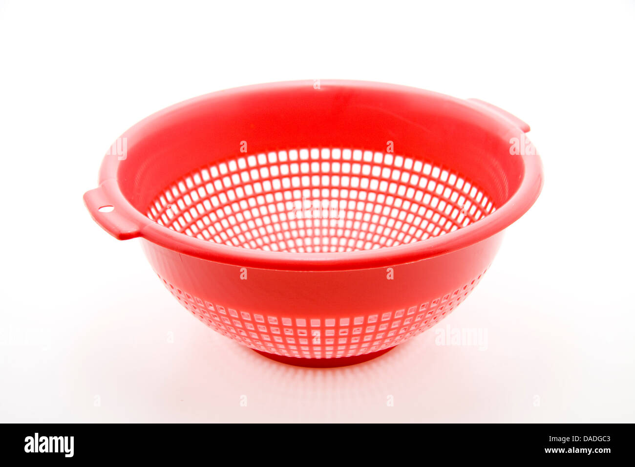 Red kitchen sieve Stock Photo Alamy