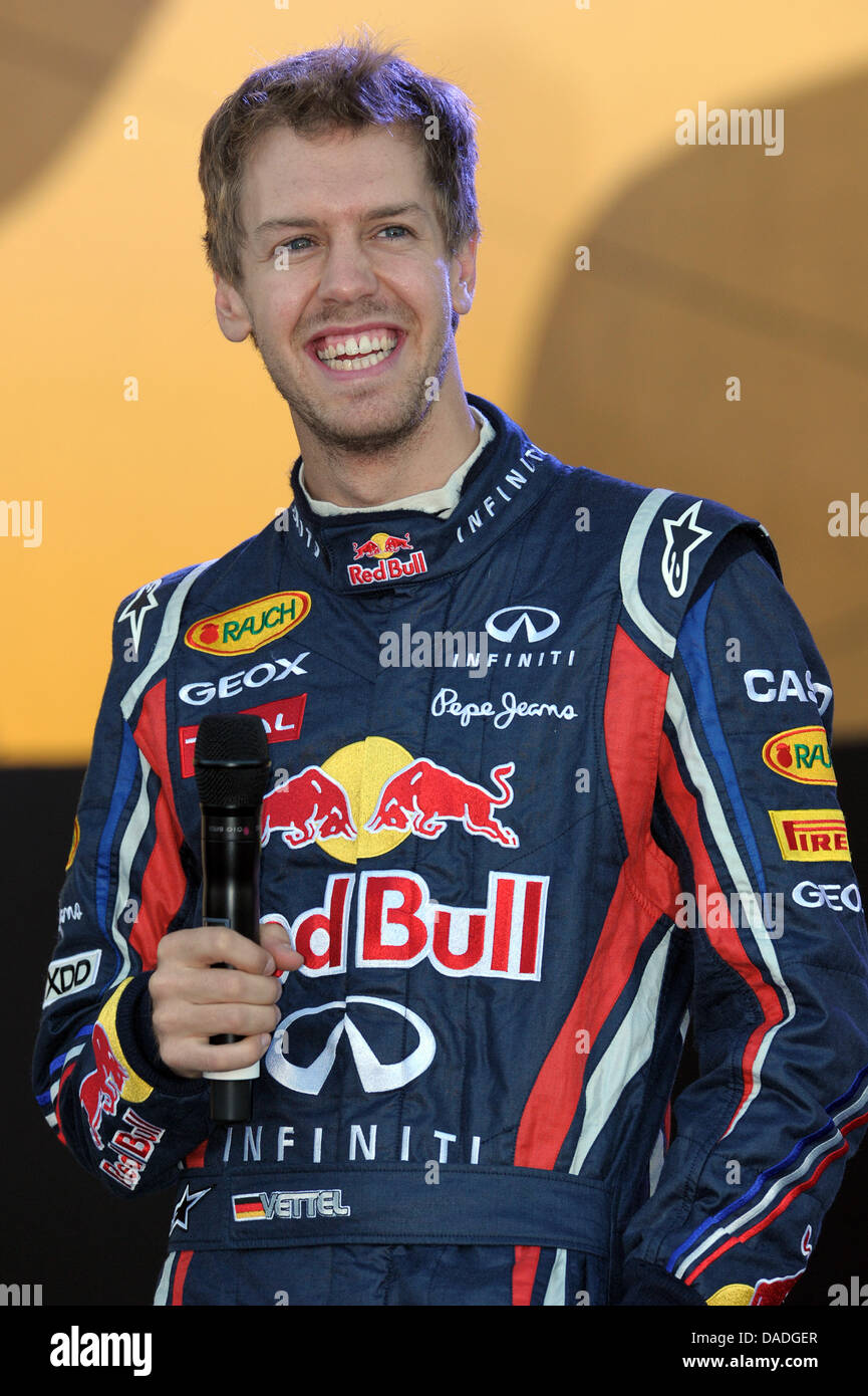 German Formula One champion Sebastian Vettel of team Red Bull smiles during  the 'Vettel Championship Party' in his hometown Heppenheim, Germany, 22  October 2011. The 24-year-old won his second consecutive championship at