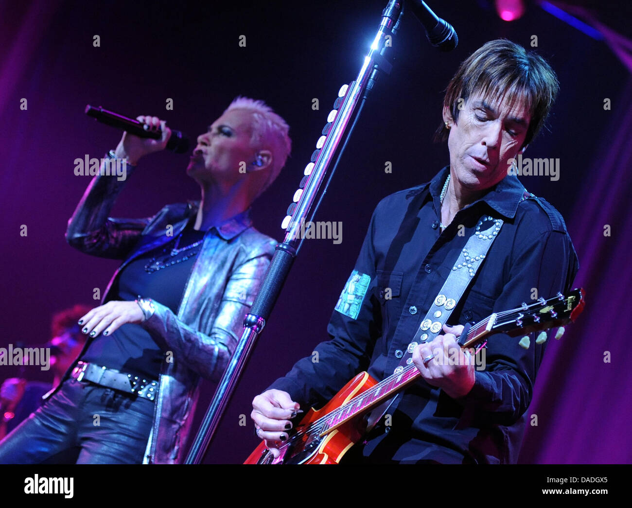 Marie Fredriksson and singer Per Gessle of the Swedish pop duo Roxette perform on stage of the o2 World in Berlin, Germany, 24 October 2011. The musicians present their new album 'Charm School'. Photo: Britta Pedersen Stock Photo