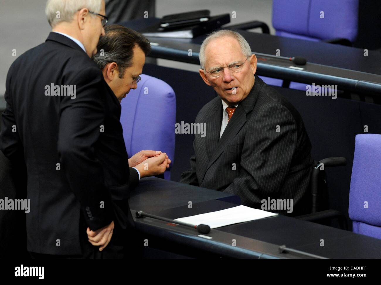 Rainer Bruederle (R), chairwoman of the FDP Bundestag parliamentary group, talks with German Minister of Finance, Wolfgang Schaueble, before the vote on strengthening the Euro rescue package at the Bundestag, Berlin, Germany, 26 October 2011. Merkel will give a speech on her positions regarding the negotiations in Brussels. Then a roll-call vote will be held on new instrumenst of t Stock Photo