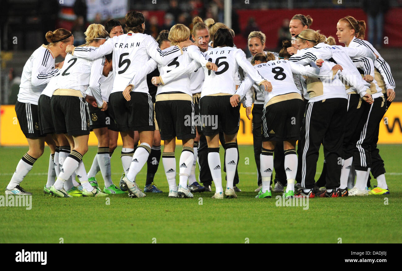 Germany's national women's soccer team stand in a circle prior to the ...