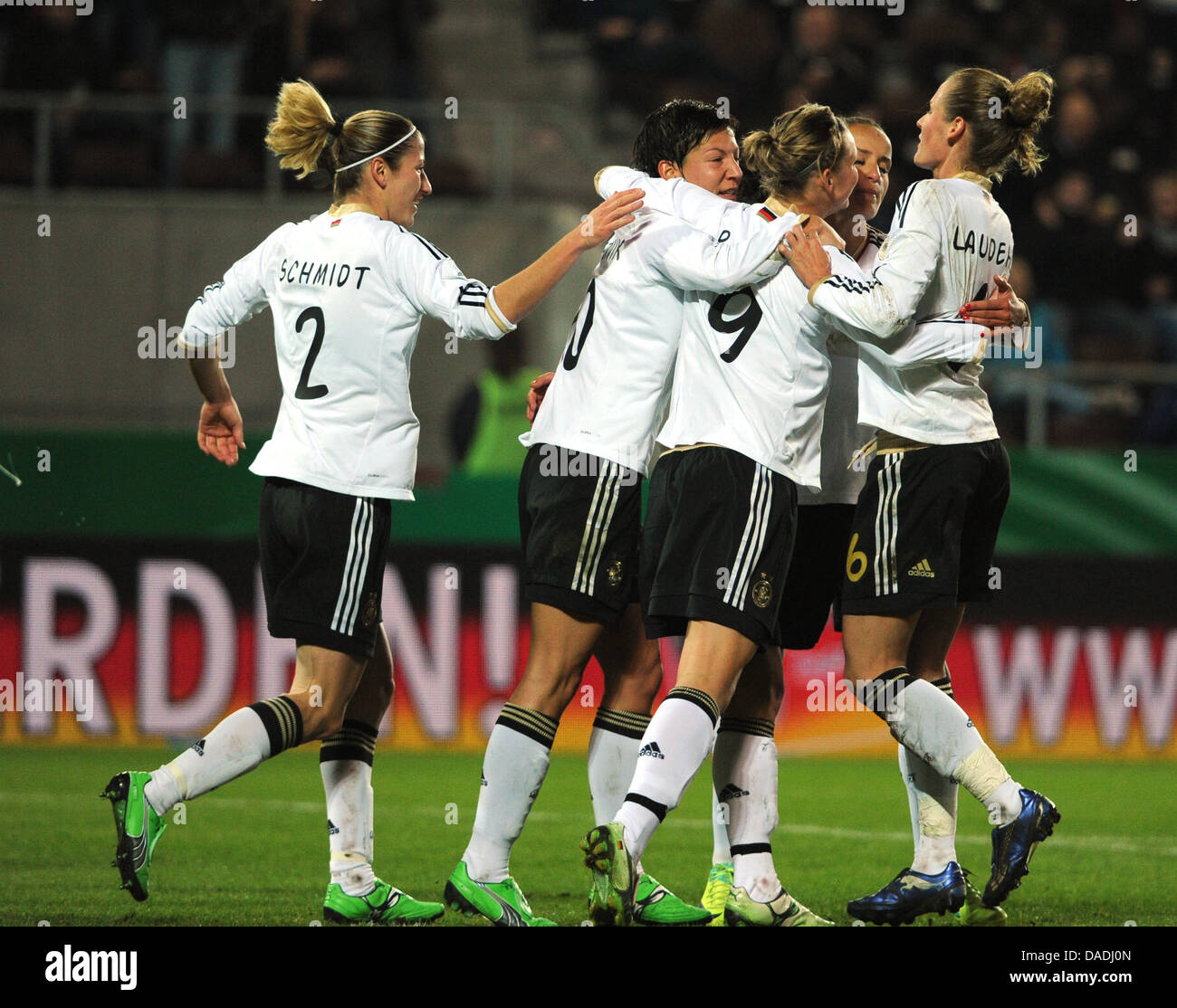 Germany's players celebrate after their teammate Alexandra Popp (C) scores the 1-0 lead goal during the international women's soccer test match between Germany and Sweden at the Millerntor-Stadion in Hamburg, Germany, 26 October 2011. Photo: Angelika Warmuth Stock Photo