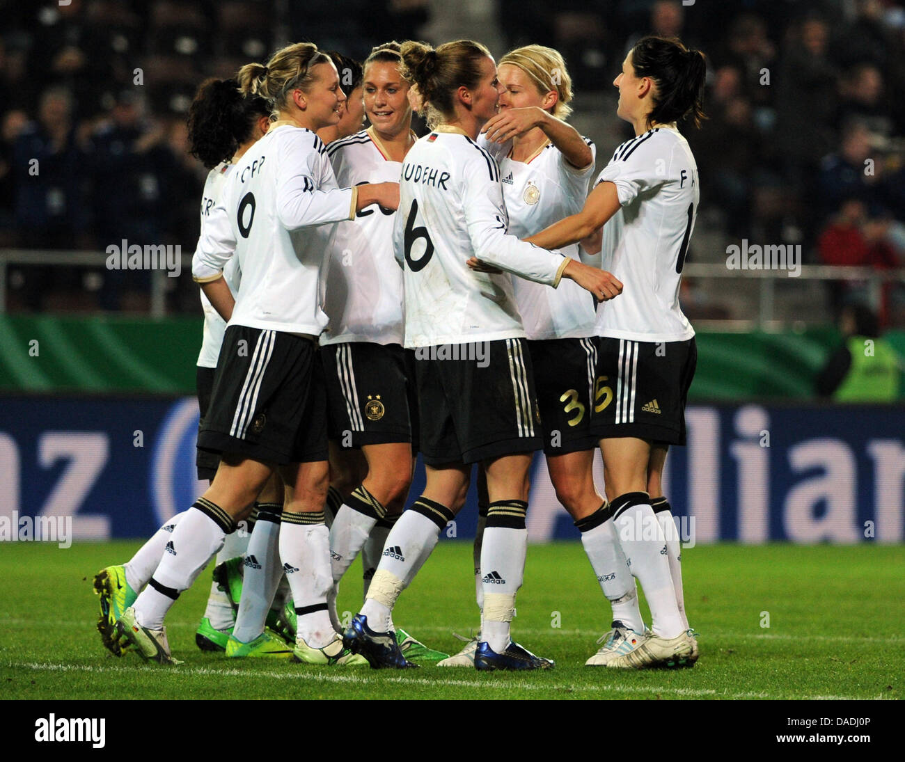 Germany's players celebrate after their teammate Alexandra Popp (L) scores the 1-0 lead goal during the international women's soccer test match between Germany and Sweden at the Millerntor-Stadion in Hamburg, Germany, 26 October 2011. Photo: Angelika Warmuth Stock Photo