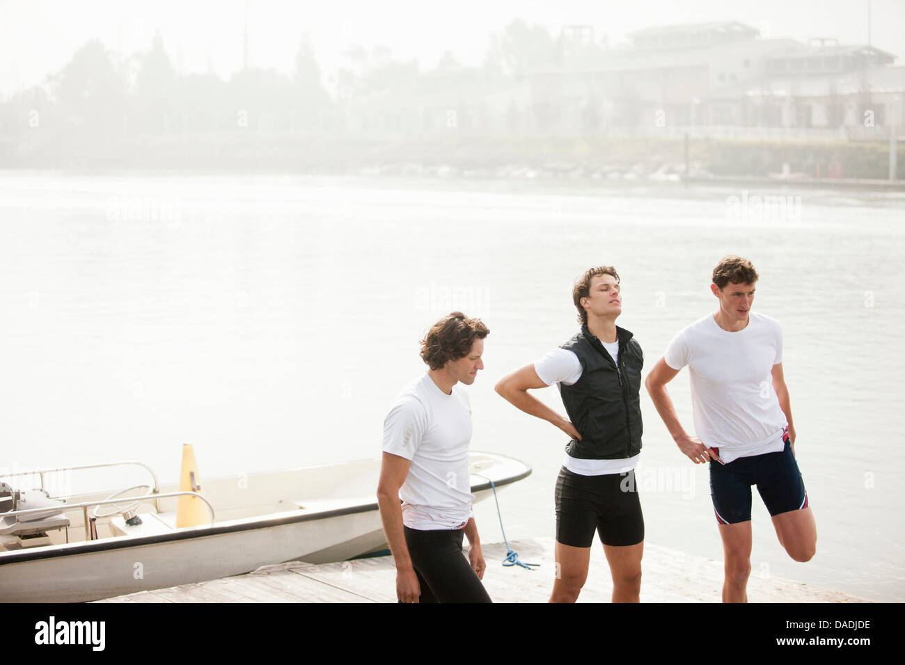 Men doing stretching exercise Stock Photo