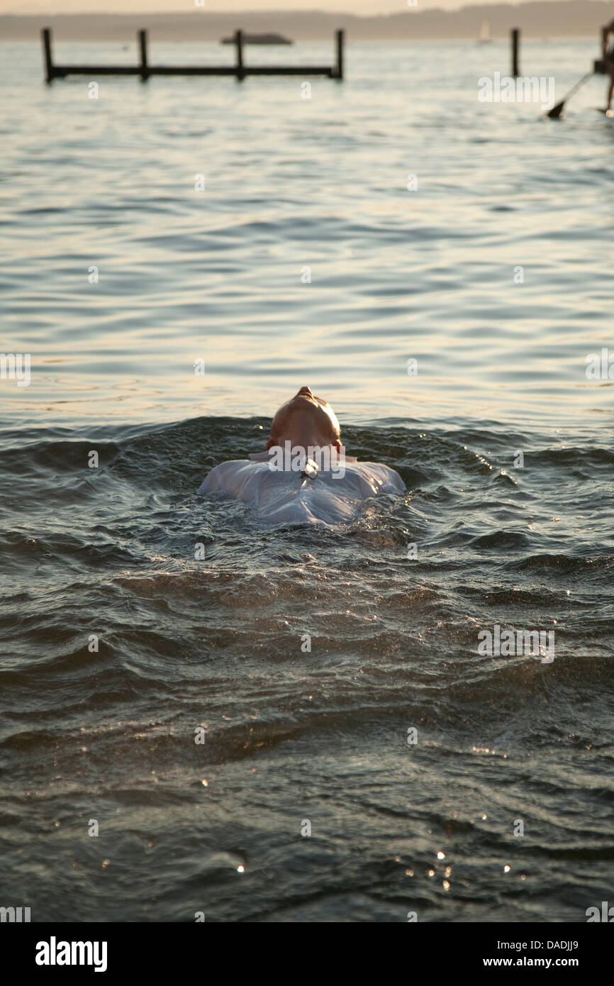 Man floating in water Stock Photo Alamy
