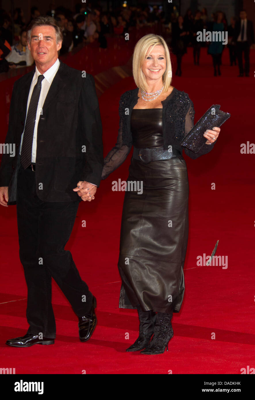 British-Australian actress Olivia Newton-John (R) and her husband Amazon John Easterling attend the premiere of her new film 'A Few Best Men' during the 6th International Rome Film Festival at Auditorium Parco Della Musica in Rome, Italy, on 28 October 2011. Photo: Hubert Boesl Stock Photo