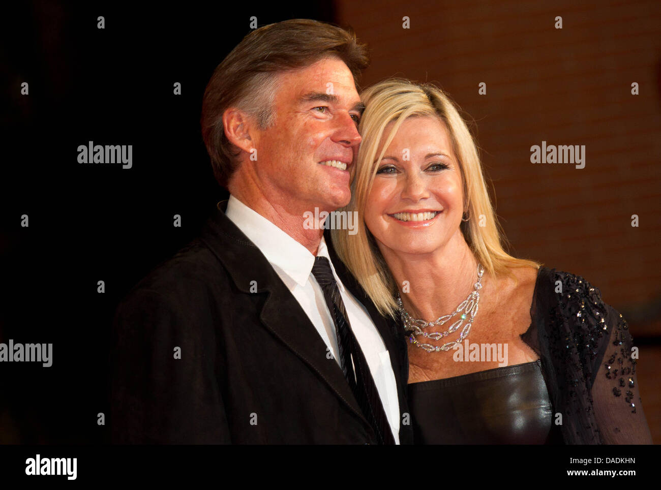 British-Australian actress Olivia Newton-John (R) and her husband Amazon John Easterling attend the premiere of her new film 'A Few Best Men' during the 6th International Rome Film Festival at Auditorium Parco Della Musica in Rome, Italy, on 28 October 2011. Photo: Hubert Boesl Stock Photo