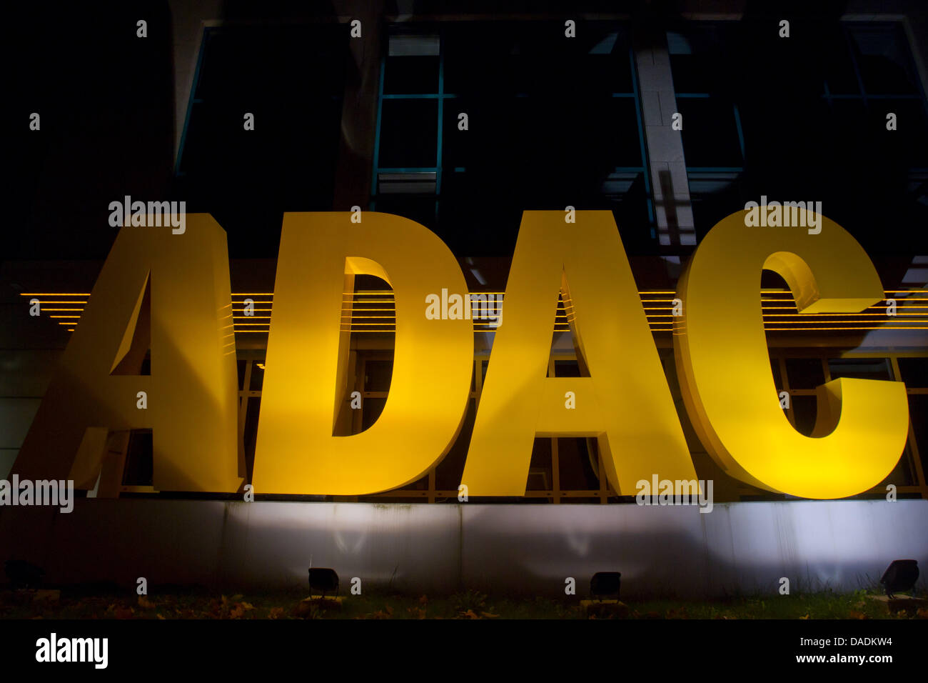 The illuminated lettering ADAC is seen at the headquarters of the automobile association ADAC-North Bavaria in Nuremberg, Germany, 28 October 2011. With some 14.6 million members, the German automobile association (ADAC) is currently Europe's largest automobile club.  Photo: Daniel Karmann Stock Photo